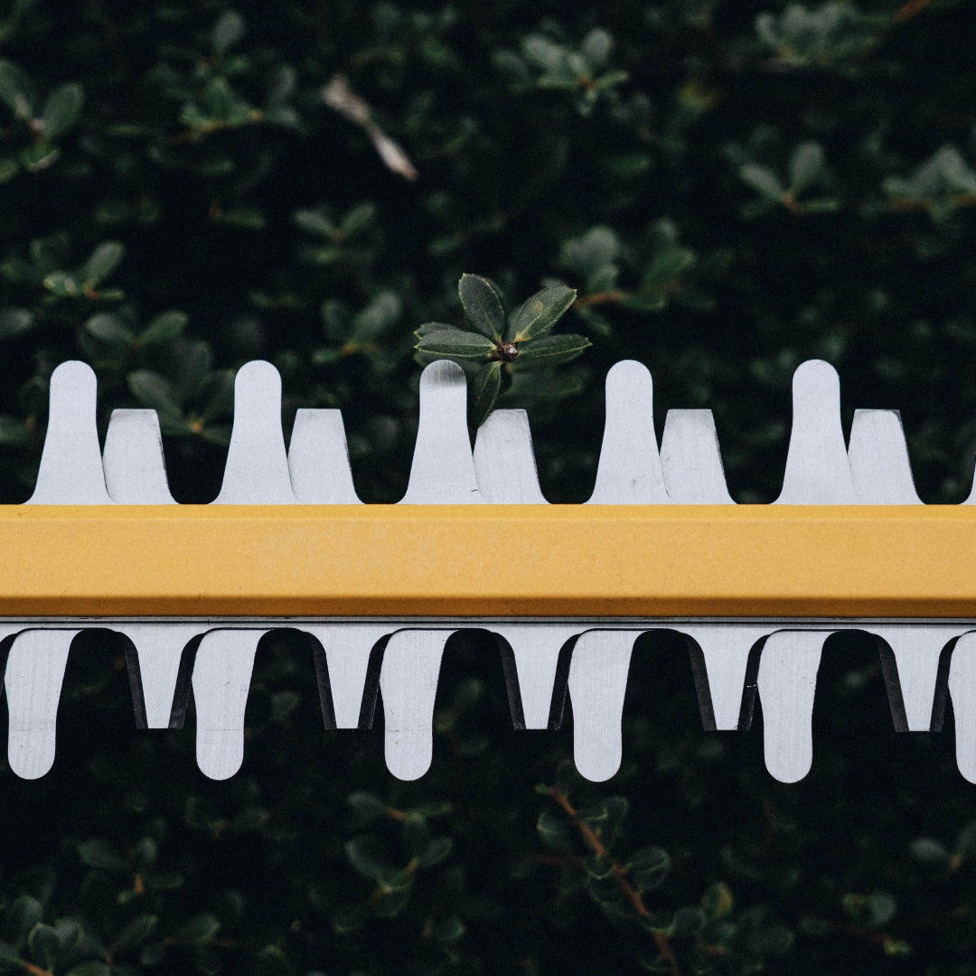 Close up of Green Machine chainsaw.
