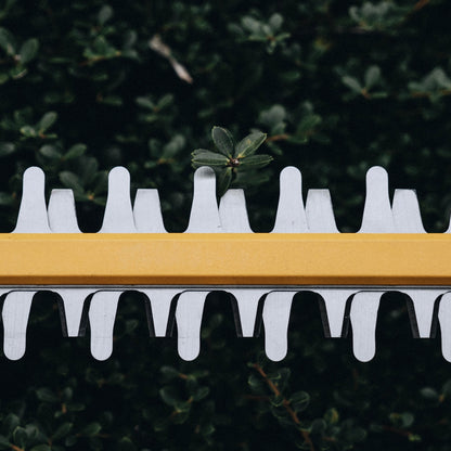 Close up of Green Machine chainsaw.